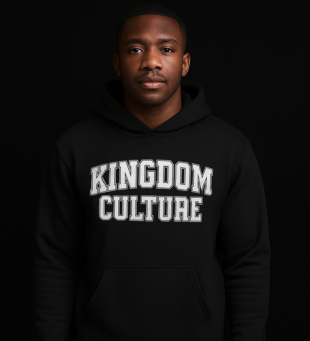 Person wearing a black hoodie with 'Kingdom Culture' text on a black background
