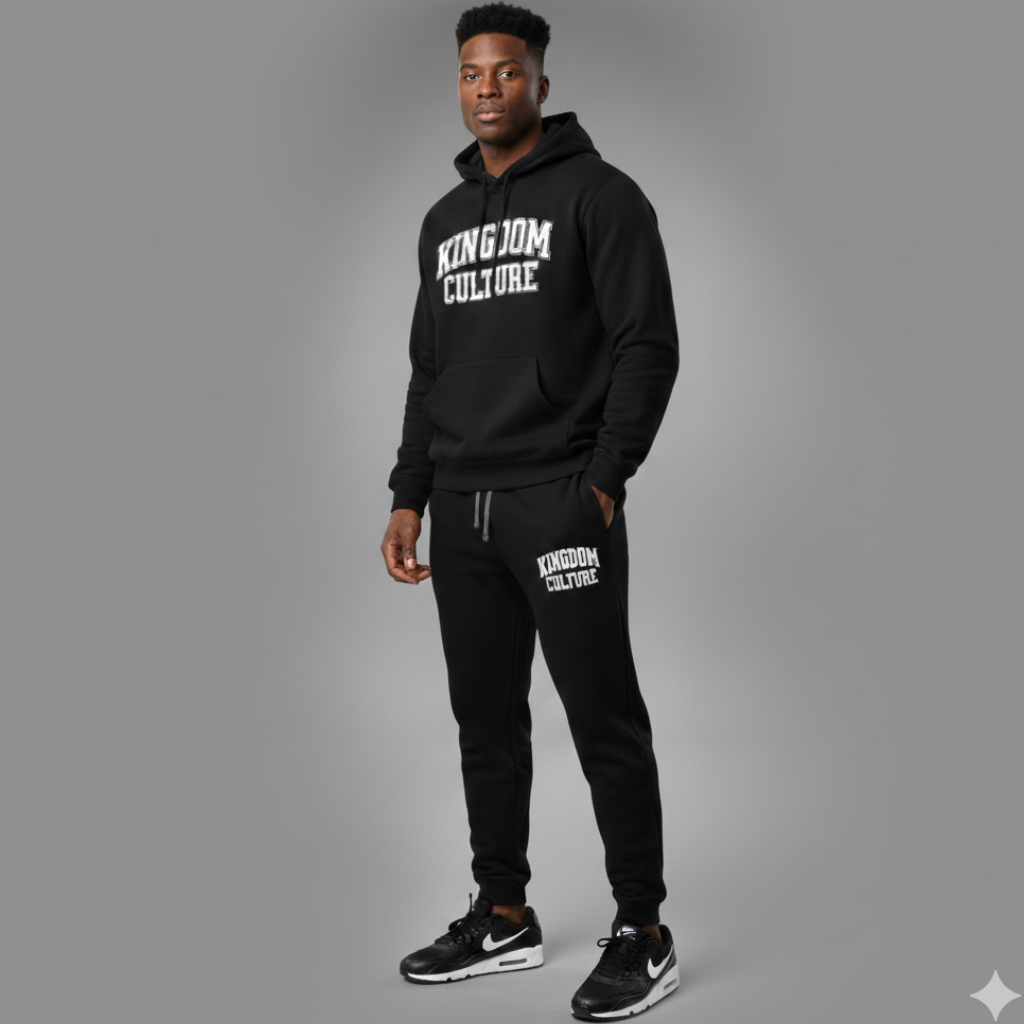 Person wearing a black 'Kingdom Culture' hoodie and pants on a gray background